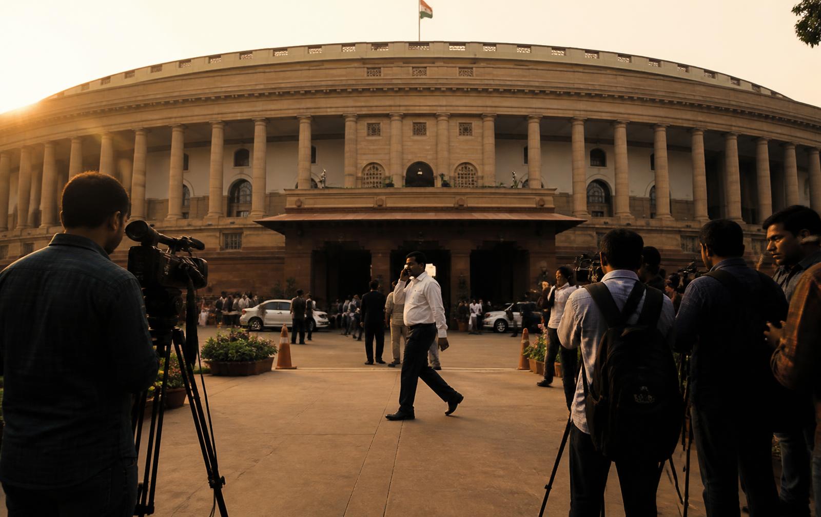 Journalists and officials outside a parliament building at golden hour
